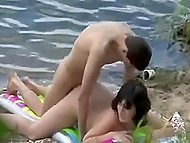 High grass allows pervert man to record sexual act of young couple on deserted beach