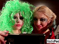 Wonderful ladies are engaged in cosplay of Joker and Harley Quinn and strapon helps them