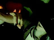 Сute brunette cunt with glasses gives a handjob to the big strong cock at the Halloween party